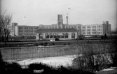 West High School, located at West 10th Ave. and Elati Street, is seen from the north bank of Cherry Creek, DPL Western History Collection Rh-640